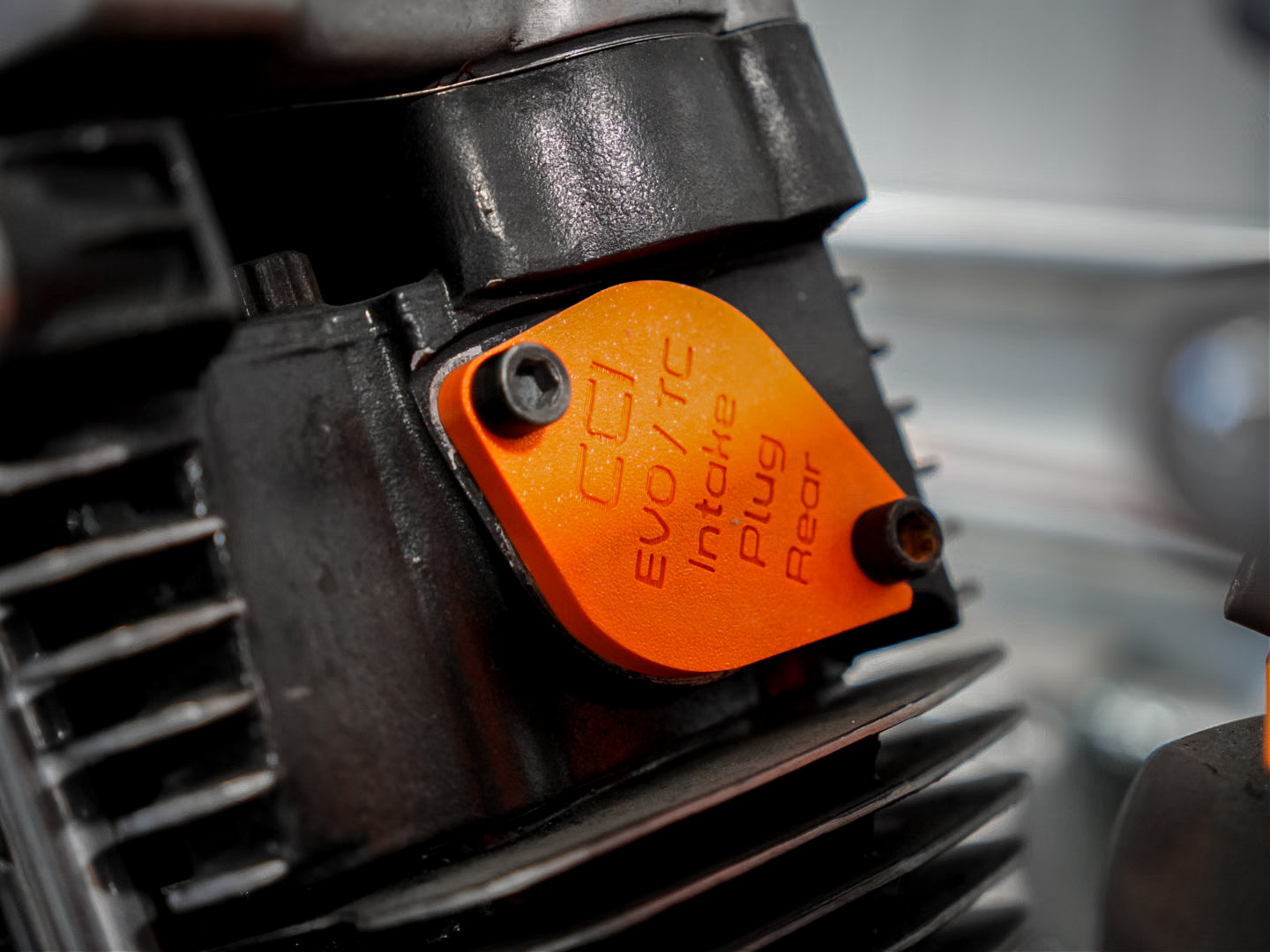 Close-up of a Evo engine with an CCI Intake Plug installed.